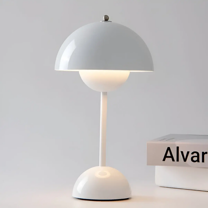 Portable LED table lamp, rechargeable and cordless. Modern Scandinavian style for indoor/outdoor use.