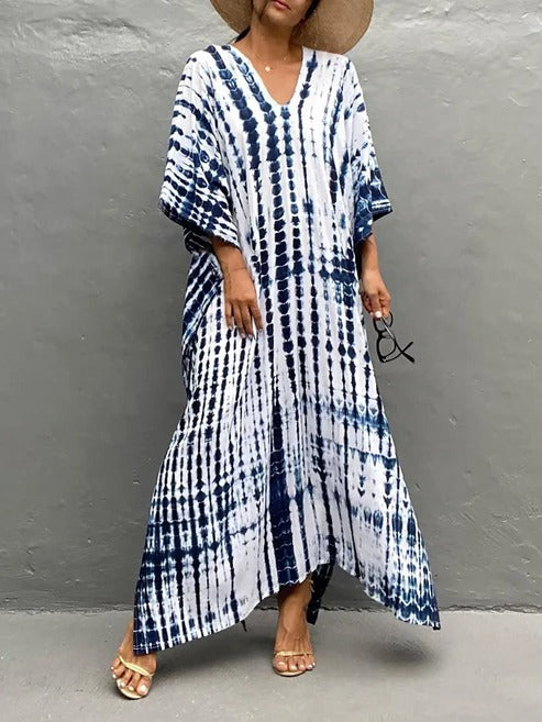 Women's summer tie-dye kaftan maxi dress. Boho chic, flowing V-neck design for beach & vacation.