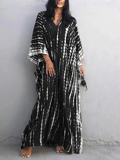 Boho chic tie-dye kaftan. Women's flowing V-neck maxi dress, perfect for beach, resort, summer.