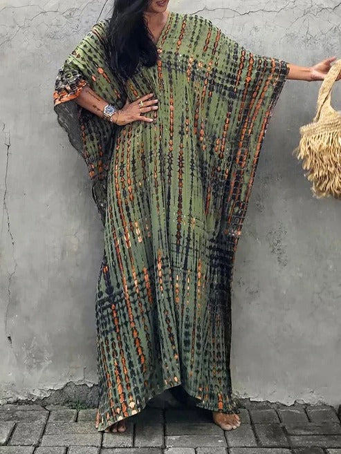Tie-dye kaftan maxi beach dress. Flowing V-neck resort wear for women, perfect for summer vacation.