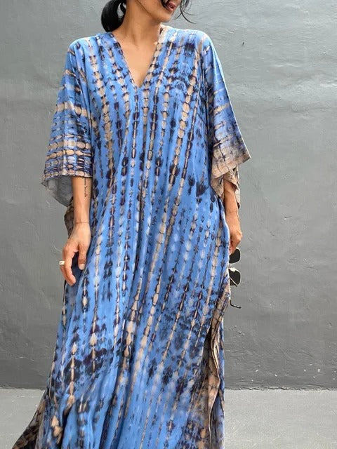 Boho chic tie-dye kaftan maxi dress for women. Perfect flowing beachwear or casual summer dress.