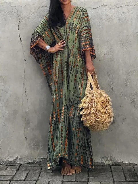 Women's elegant tie-dye maxi beach dress. Flowing kaftan style, ideal for summer resort wear.