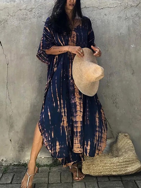 Stylish tie-dye kaftan maxi dress. V-neck, flowing boho chic for women's summer and vacation.