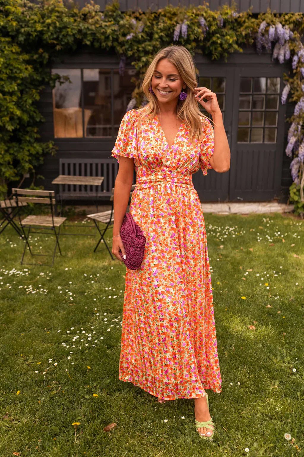 Women's relaxed floral pleated V-neck maxi dress, perfect for cocktails & summer parties.