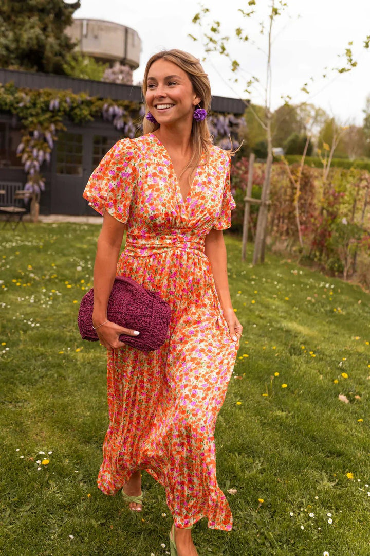 Relaxed fit women's floral pleated V-neck maxi dress, an elegant & comfortable party dress.