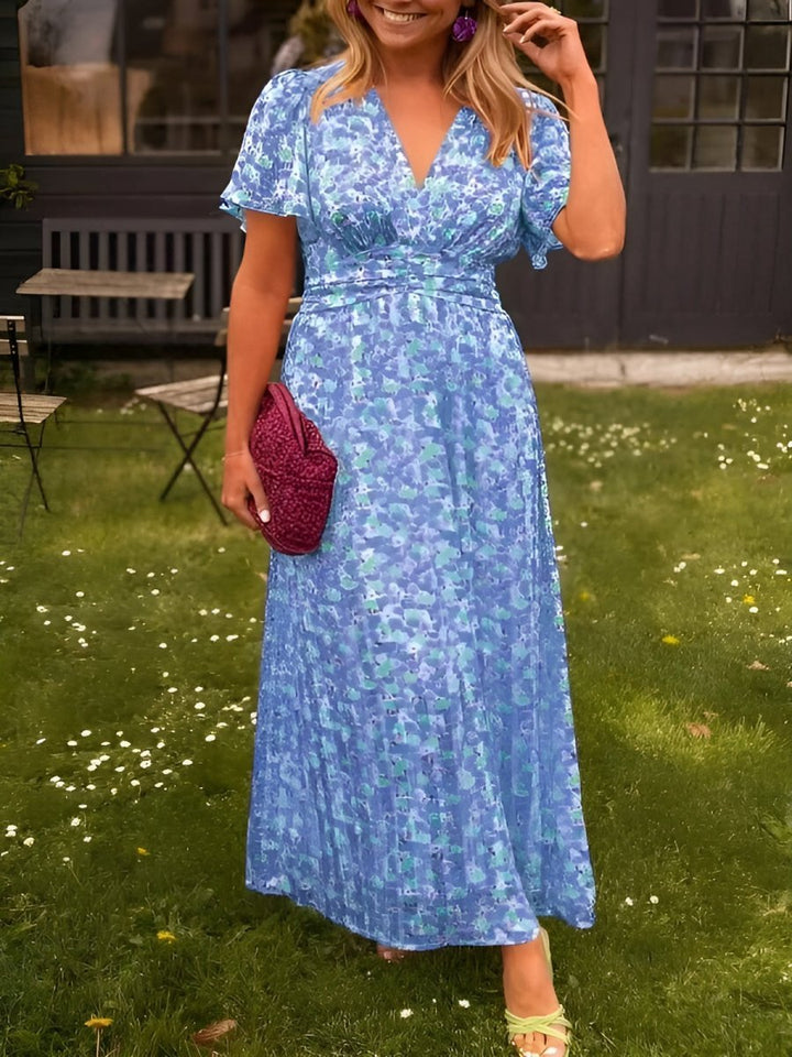 Stylish women's floral pleated V-neck maxi, perfect as an elegant cocktail or summer party dress.