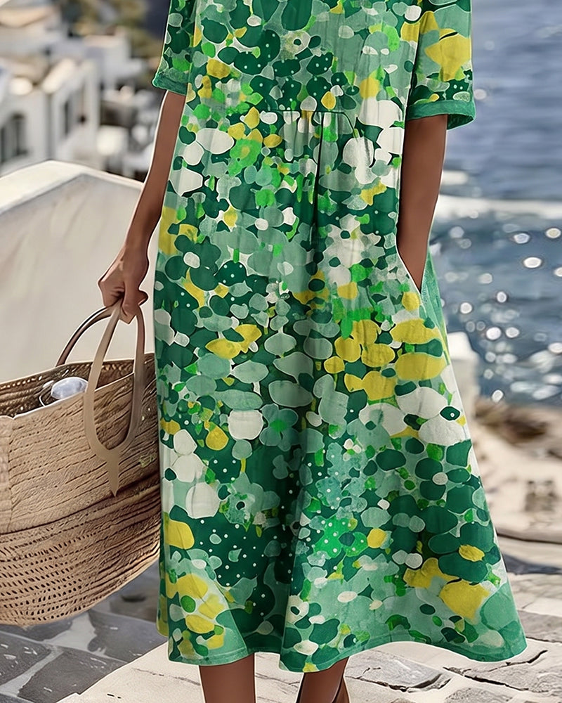 Feminine short-sleeve midi dress, featuring a sophisticated floral print and gathered waist.