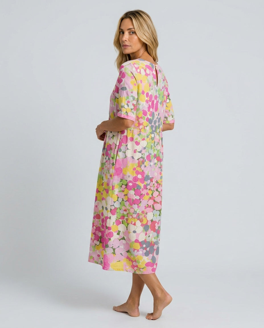 Warm weather women's floral midi dress, a versatile short-sleeve option with a gathered waist.