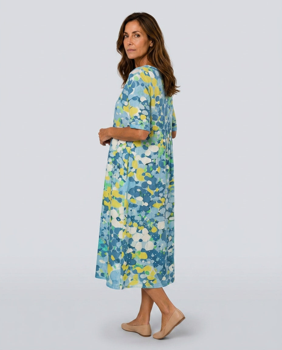 Abstract print casual midi dress for women, featuring a round neck and gathered waist.