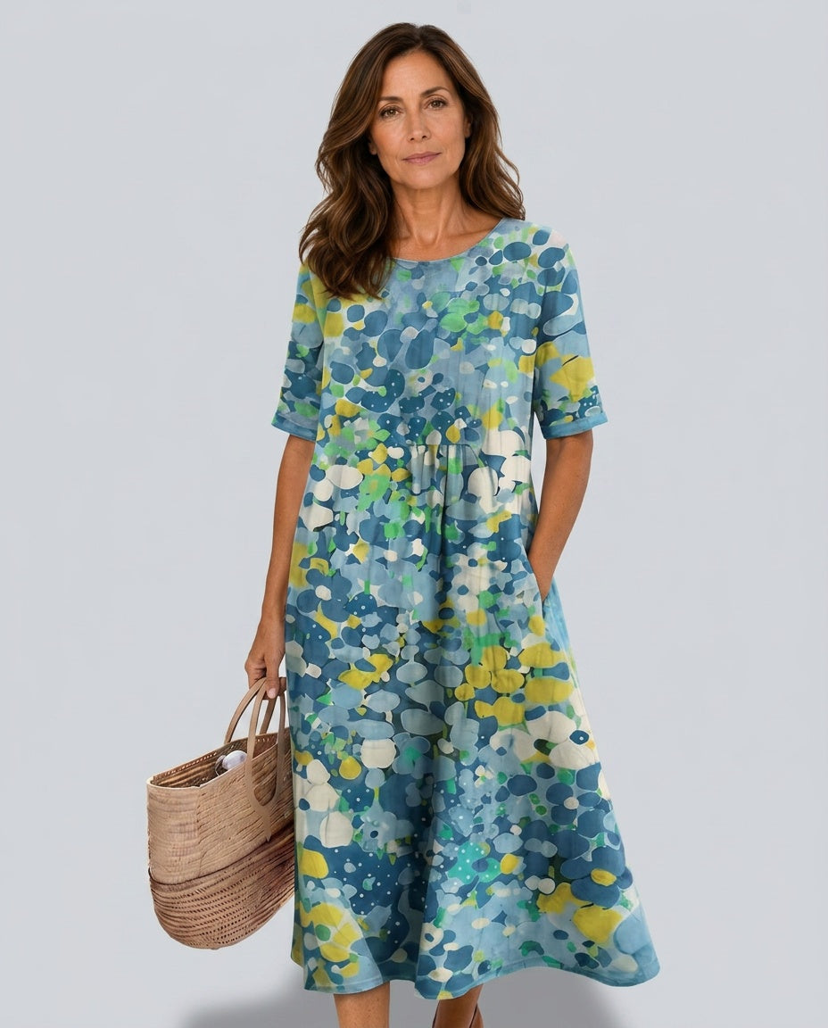 Feminine floral short-sleeve midi dress, comfortable and versatile for warm weather.