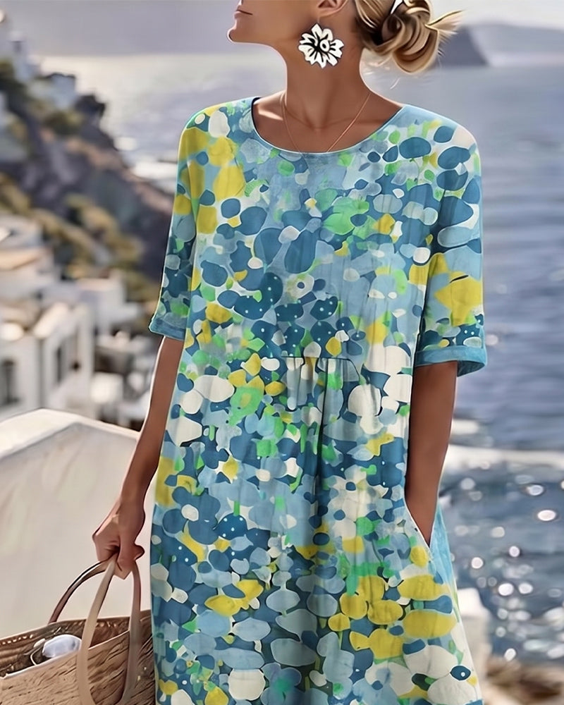 Comfortable women's summer midi dress, featuring an elegant abstract floral print.