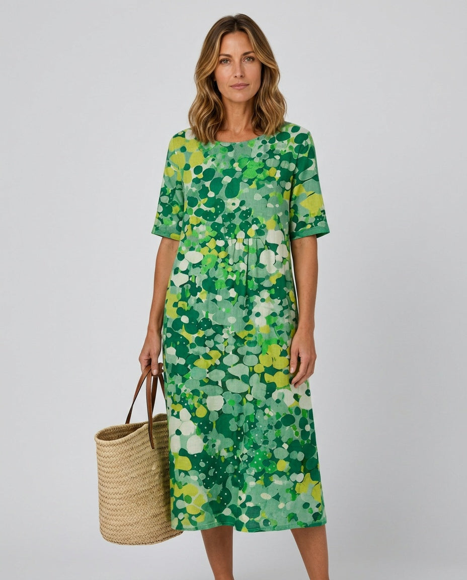 Women's elegant floral midi dress with a round neck and gathered waist, for summer.
