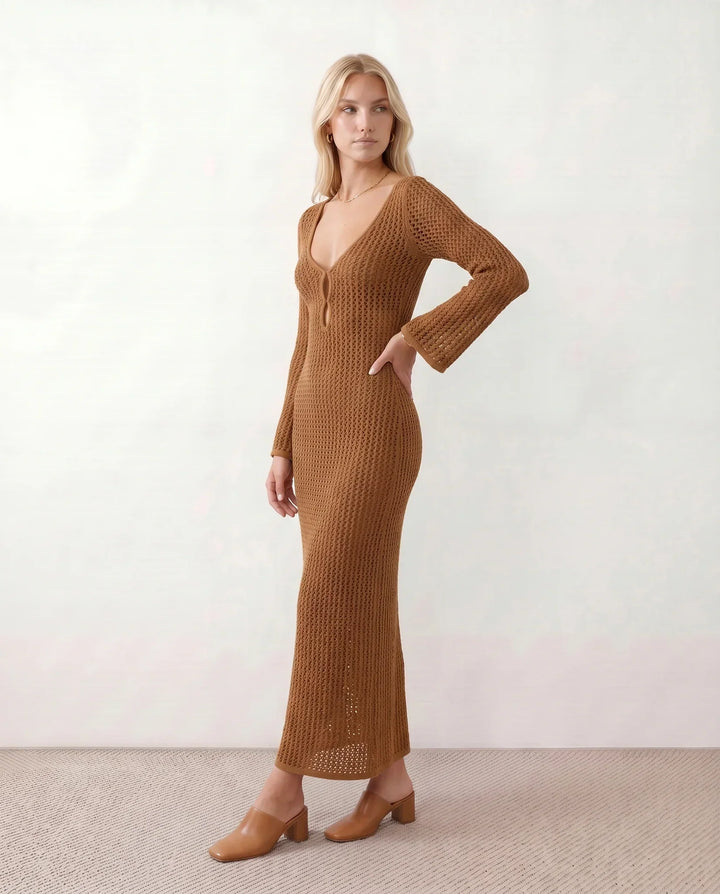 Chic women's plunge neck, long sleeve crochet maxi dress. Ideal for stylish beachwear.