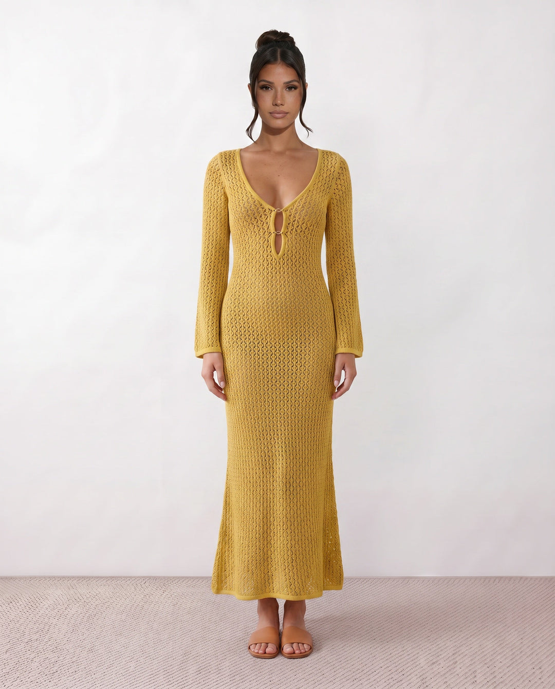 Women's elegant crochet maxi dress with plunge neckline & long sleeves. Perfect for resort.