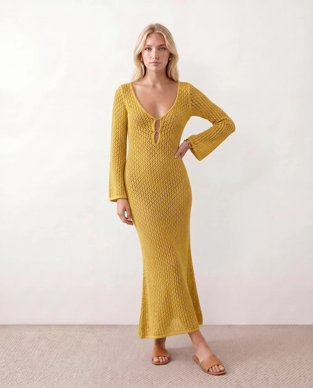 Bohemian-style long sleeve crochet maxi dress. Deep V-neck. Ideal for summer beach fashion.