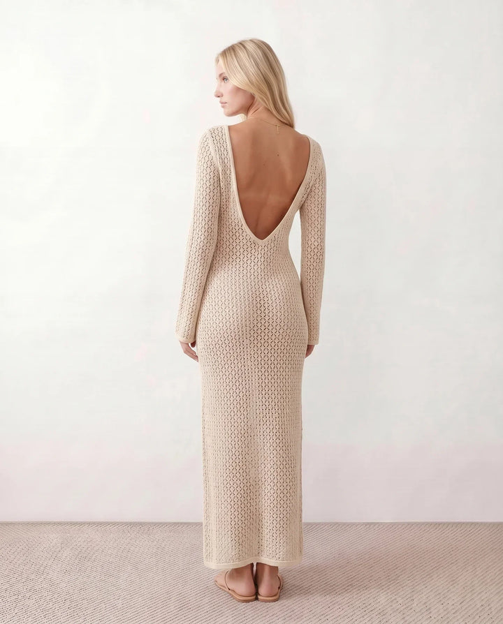 Elegant women's crochet maxi dress. Plunge V-neck, long sleeves. Beach vacation ready.
