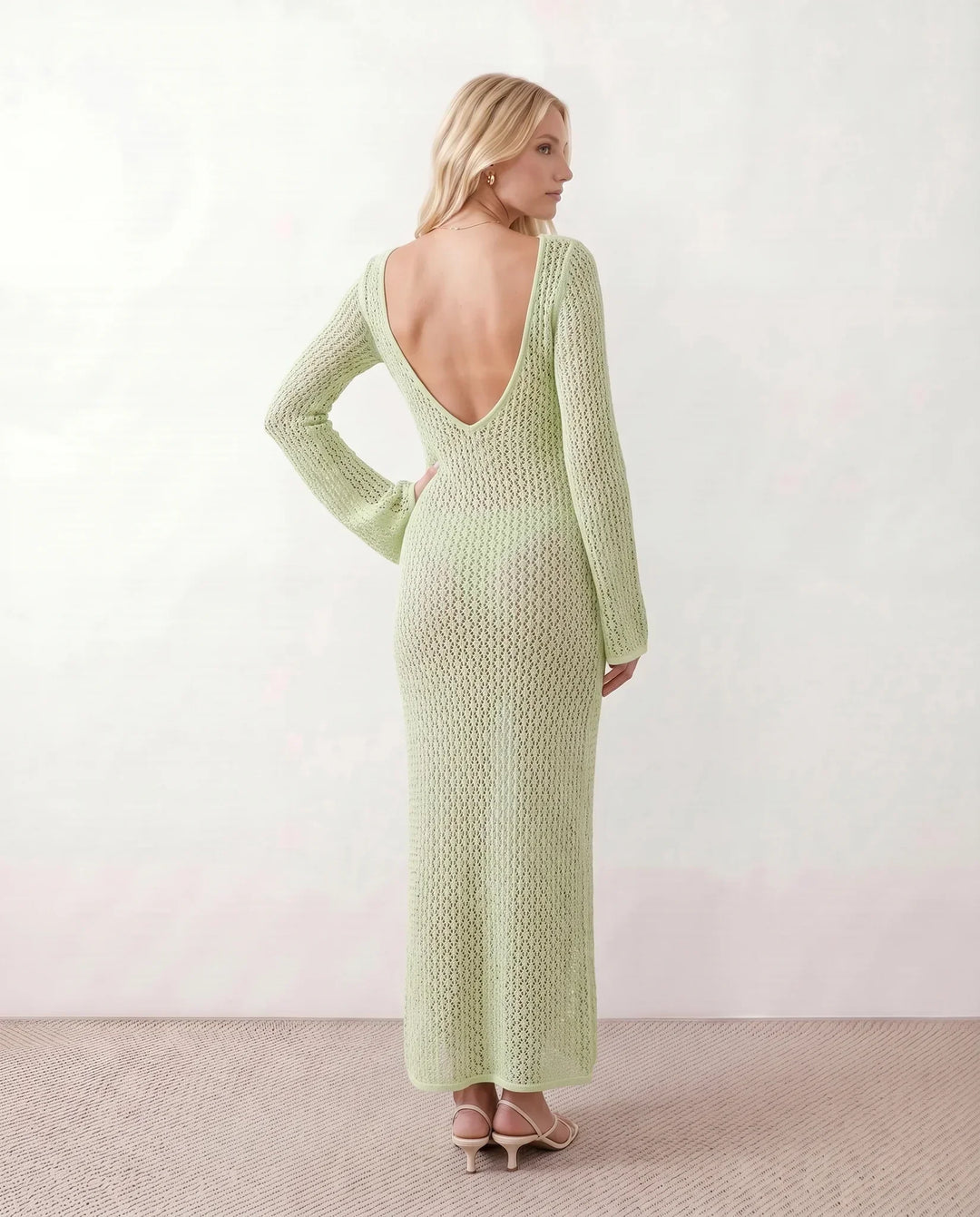 Elegant women's plunge neck long sleeve crochet maxi dress. Perfect for a summer getaway.