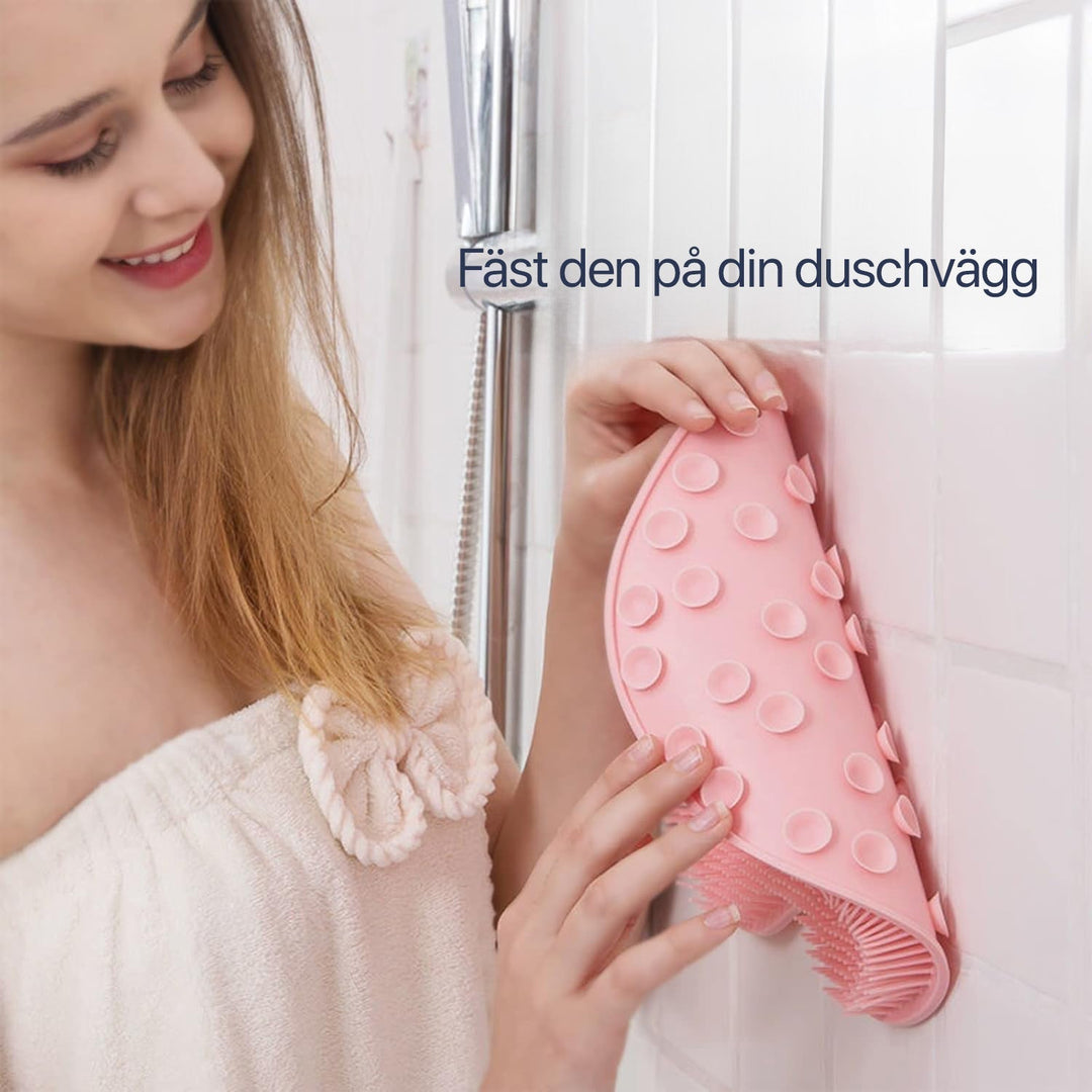 Grey silicone shower mat offering deep exfoliation and gentle massage for feet and back.