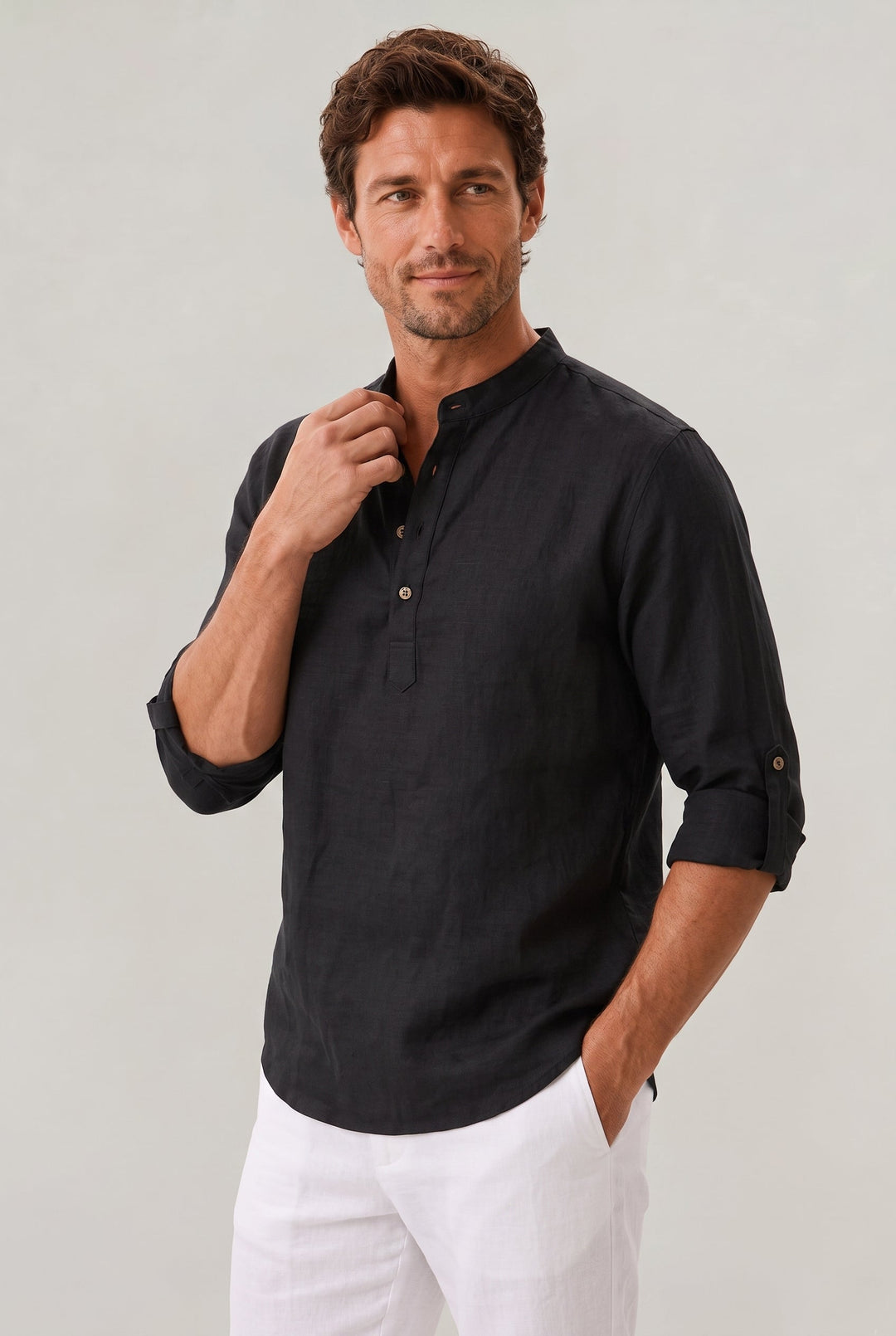 Essential men's summer shirt. Features grandad collar, roll-up sleeves, and lightweight fabric for chic comfort.