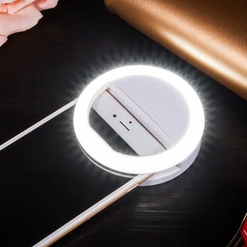Compact, portable LED ring light clips onto phones for bright selfies & video, USB rechargeable.