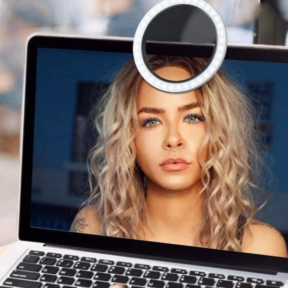 High-quality portable LED ring light with clip for phones, great for photography & video.