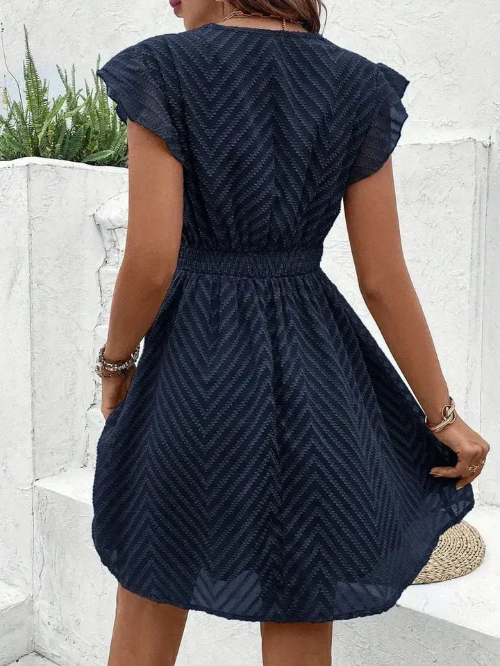 Women's casual V-neck mini dress. Chic short sleeve summer dress, perfect for parties, vacations, or daily wear.