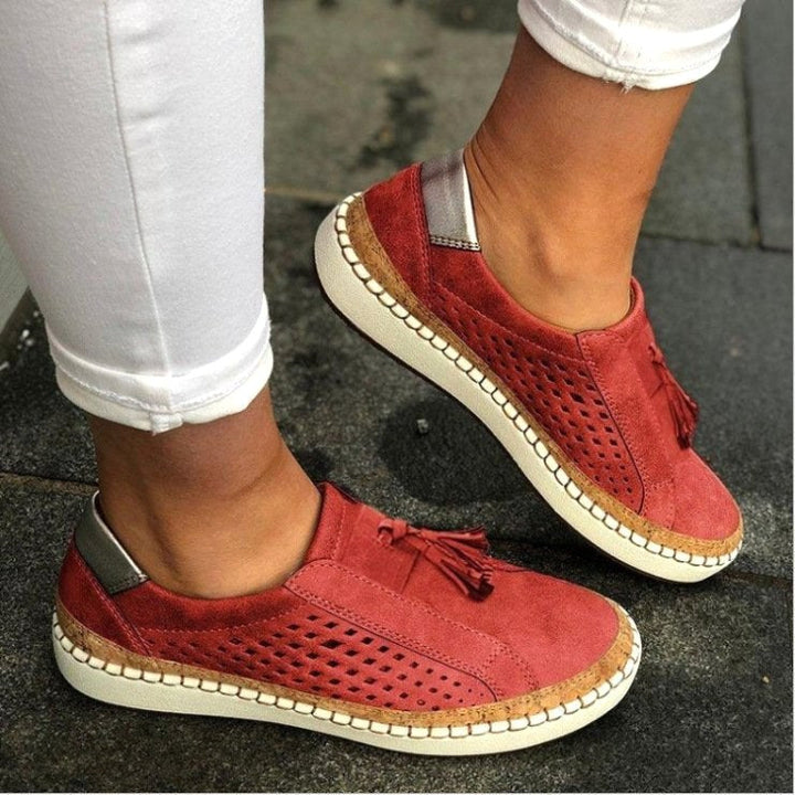 Stylish women's home slippers with orthopedic arch support for all-day comfort. Easy slip-on indoor footwear.