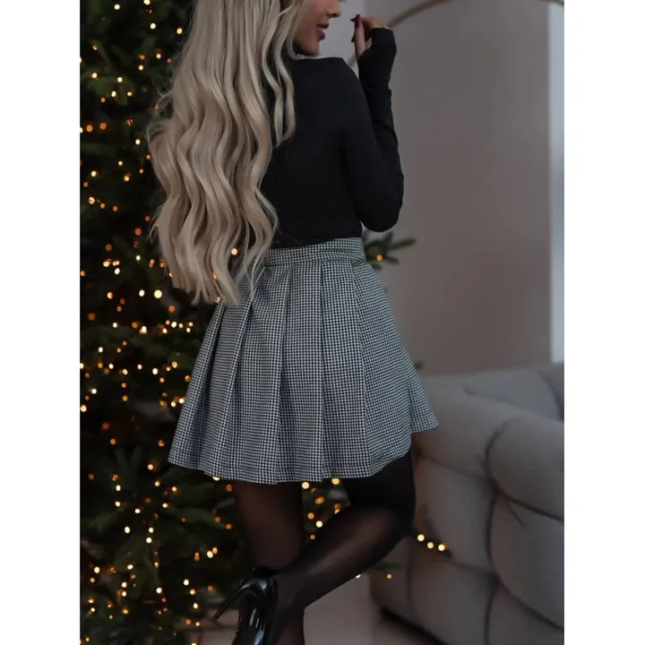 Women's Romy mini skirt. Plaid checked pattern, versatile above-knee length for chic, casual fashion.