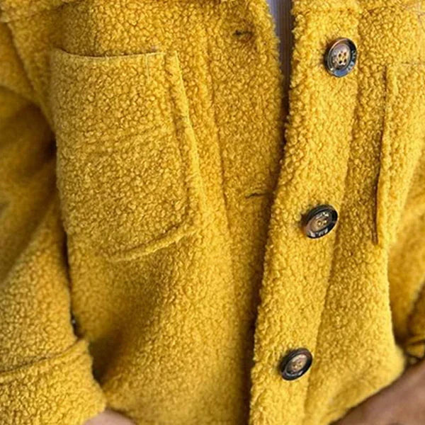 Versatile women's short teddy coat. Comfortable, cozy outerwear with a stylish lapel for casual or winter fashion.
