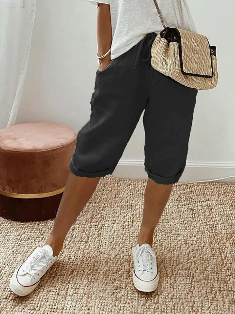 Women's versatile lightweight capri pants with a drawstring waist, great for casual elegance.
