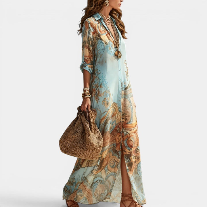 Long women's shirt dress with vibrant Mediterranean print, perfect for summer casual or resort elegance.