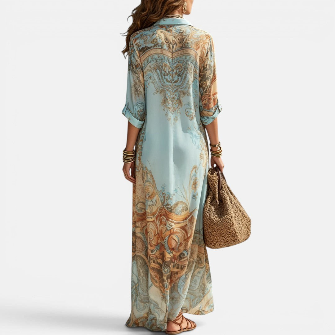 Flowing women's maxi shirt dress featuring a beautiful Mediterranean print. Comfortable summer fashion.