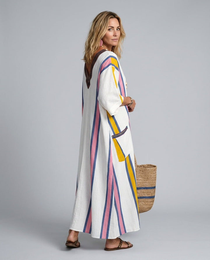Effortless women's striped kaftan beach dress, a loose-fit maxi with V-neck, ideal for resort and holiday wear.