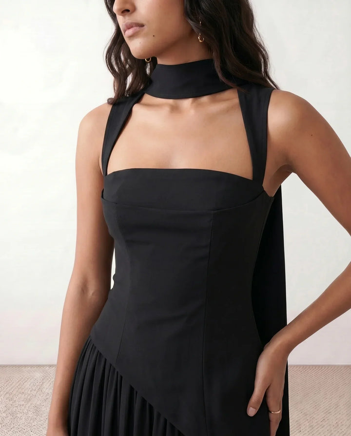 Modern women's elegant maxi dress, featuring a prominent corset and lace-up front, with a stylish thigh split.
