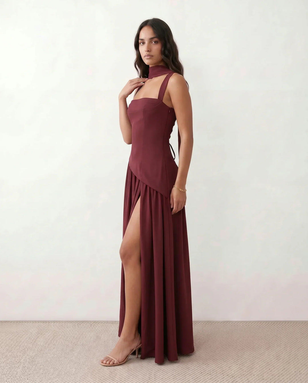Alluring lace-up corset maxi dress for women, featuring a high thigh split. Ideal as a wedding guest outfit.