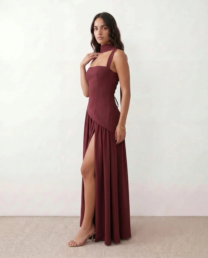Alluring lace-up corset maxi dress for women, featuring a high thigh split. Ideal as a wedding guest outfit.
