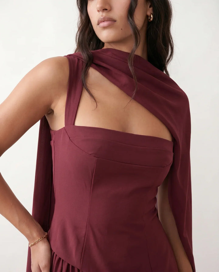 Flowing women's maxi dress, styled with a corset lace-up bodice and a chic thigh split. Perfect for races.