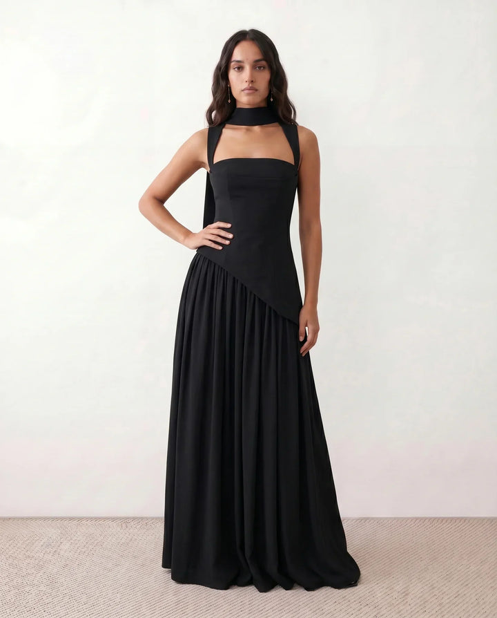 Chic women's wedding guest maxi dress with a corset lace-up design and a graceful thigh split. Stylish evening wear.