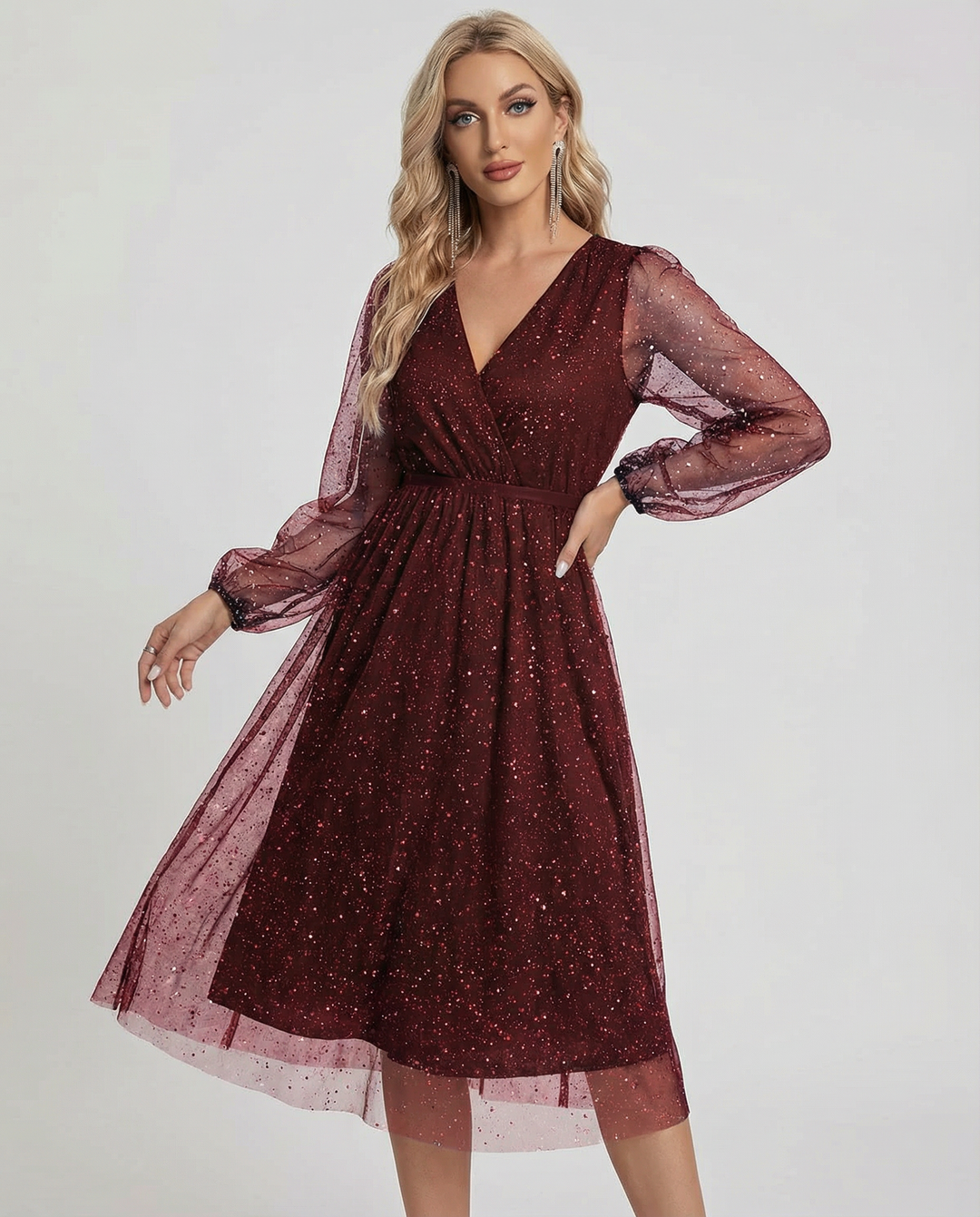 Glamorous women's mini party dress featuring shimmering mesh long sleeves. A dazzling choice for special occasions.