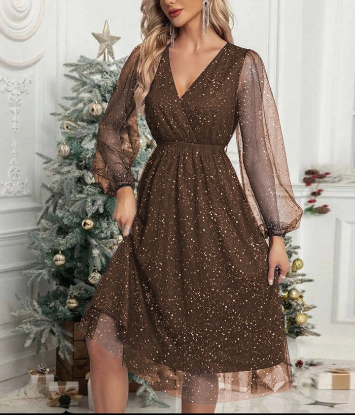 Sparkly women's mini party dress with shimmering mesh long sleeves. Ideal for elegant evening and cocktail wear.