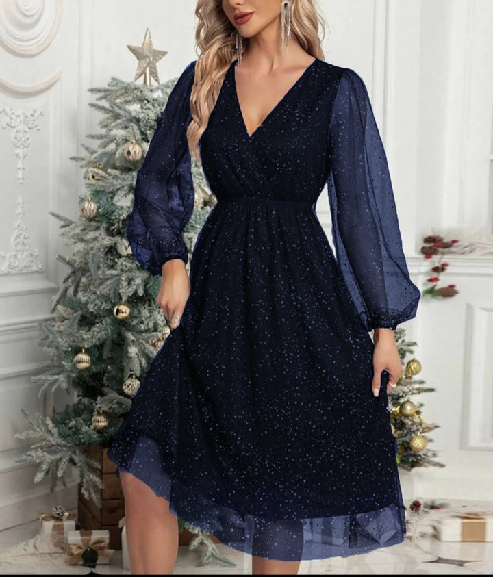 Women's special occasion mini dress with shimmering mesh sleeves. A glamorous, sparkly choice for evening parties.