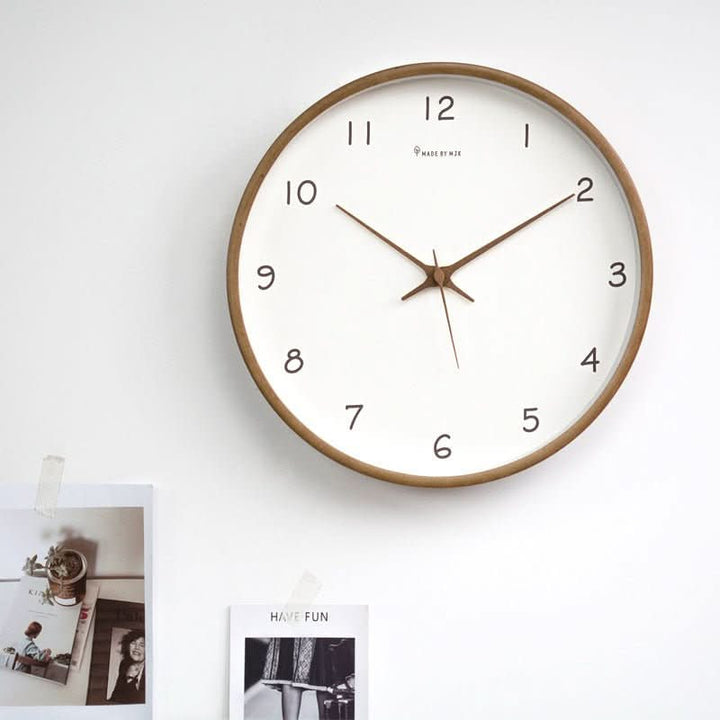 Quiet wall clock made of beautiful solid wood, enhancing living room decor with its minimalist design.