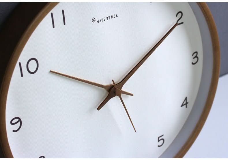 Modern solid wood analog clock, designed to be silent for a peaceful bedroom or focused office environment.