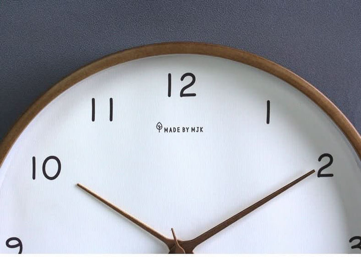 Stylish home decor wall clock in solid wood, a silent analog timepiece for contemporary living spaces.