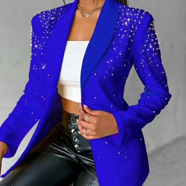Modern women's slim-fit blazer with pearl embellishments, a versatile piece for office or evening fashion.