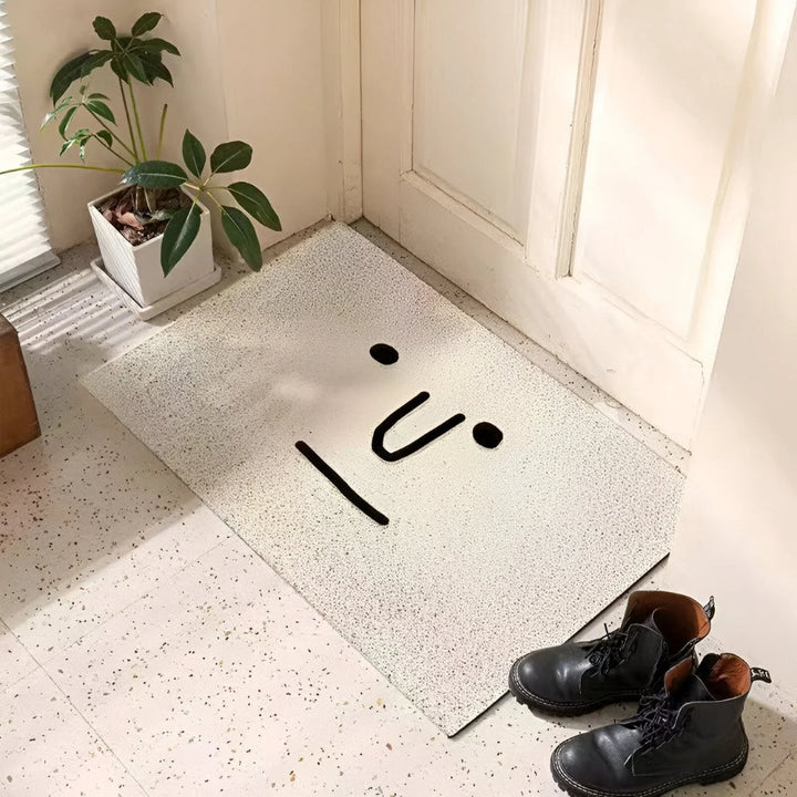 Cheerful smiley face doormat, welcoming guests. Durable, non-slip indoor/outdoor entrance mat.