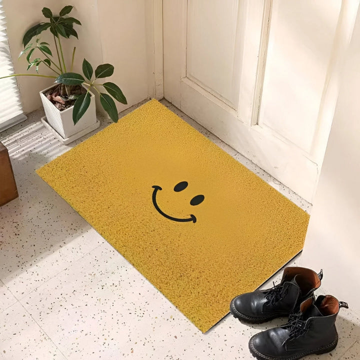Playful smiley face welcome mat. Cheerful home decor for your front door or entryway. Durable & non-slip.