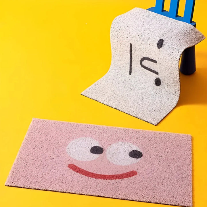Smiley face non-slip doormat. Cheerful welcome mat for indoor or outdoor home entryway decor.