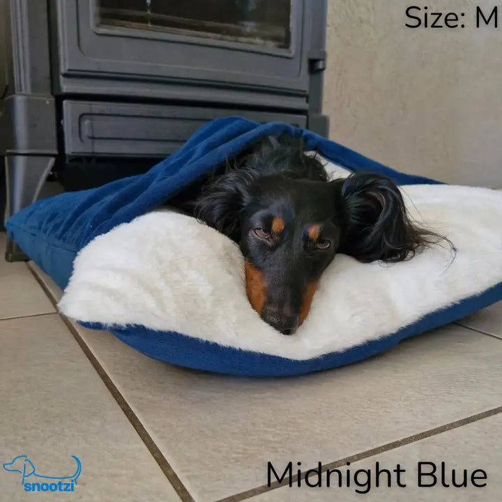 Anxiety relief CuddleNest dog bed. Soft, cozy burrow pet bed with integrated comfort wrap for ultimate pet comfort.
