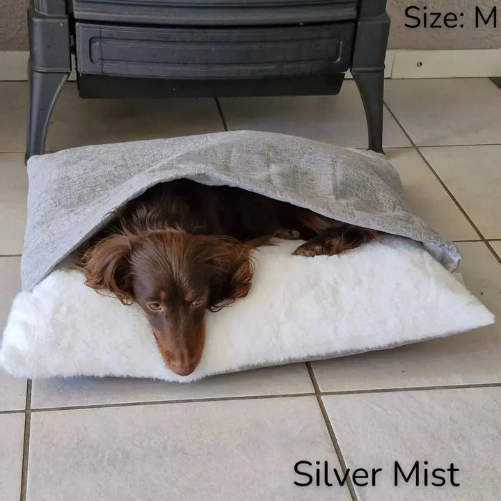Luxury CuddleNest pet bed with integrated comfort wrap. A soft, washable dog lounger for burrowing & anxiety relief.